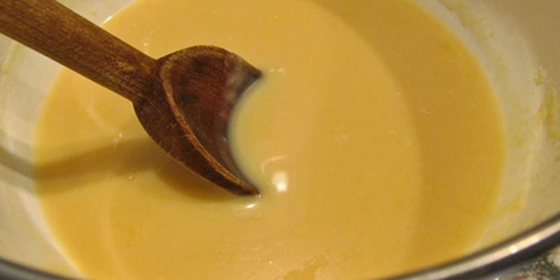 Bowl of condensed milk with spoon