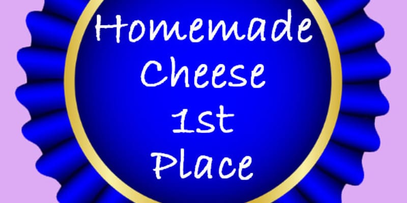 An animated blue ribbon with the phrase "Homemade Cheese 1st Place"