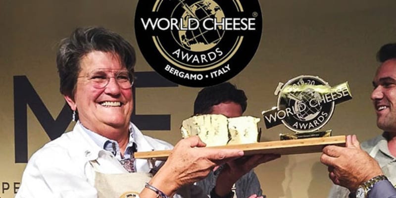 woman receiving world cheese award