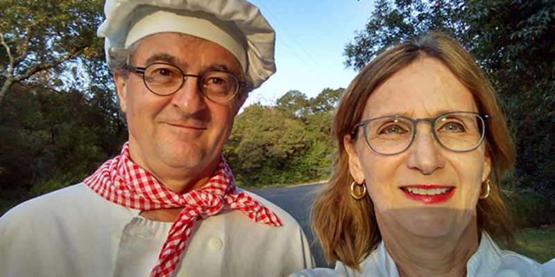 Selfie of husband and wife in baker uniforms